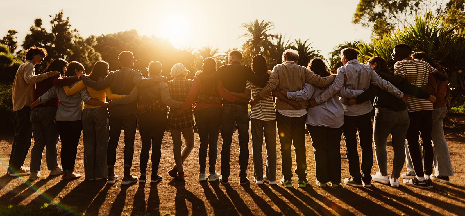 A community of team members gathered together at a public event